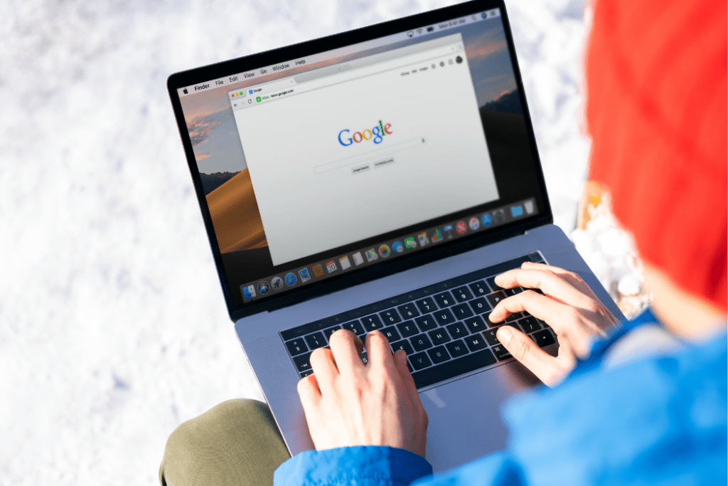 Google Business Website Profile Shutting Down - a person on a laptop, with a window ope on google.com