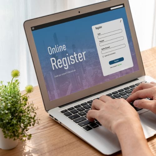 black and white target with yellow darts and coral background